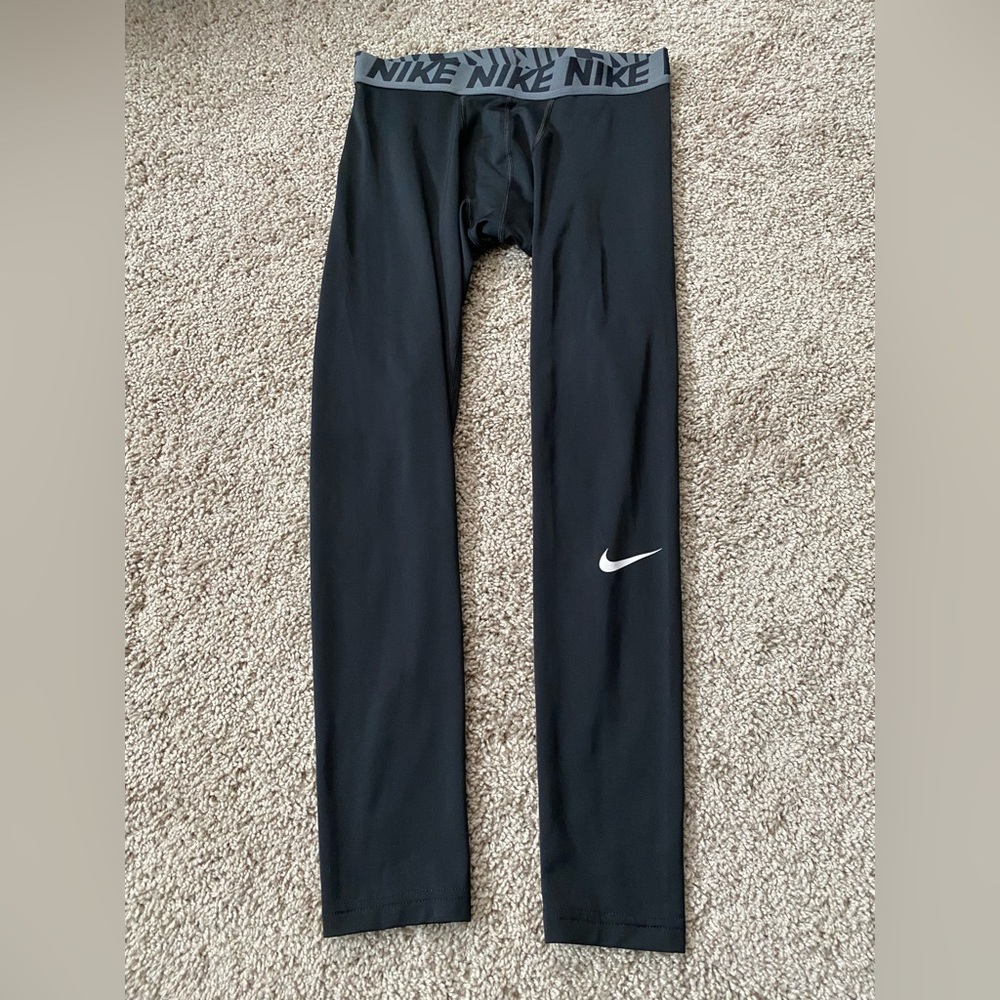 This is a pair of Nike Pro men's black compression training